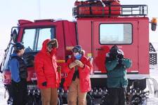 The snow stake crew in front of the Piston Bully.JPG